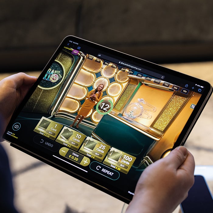Evolution Live Casino Games on a Tablet banner